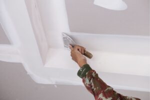 Plaster being applied in the interior of a home